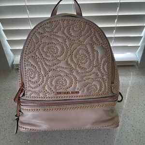 MK blush with rose gold studs and zippers